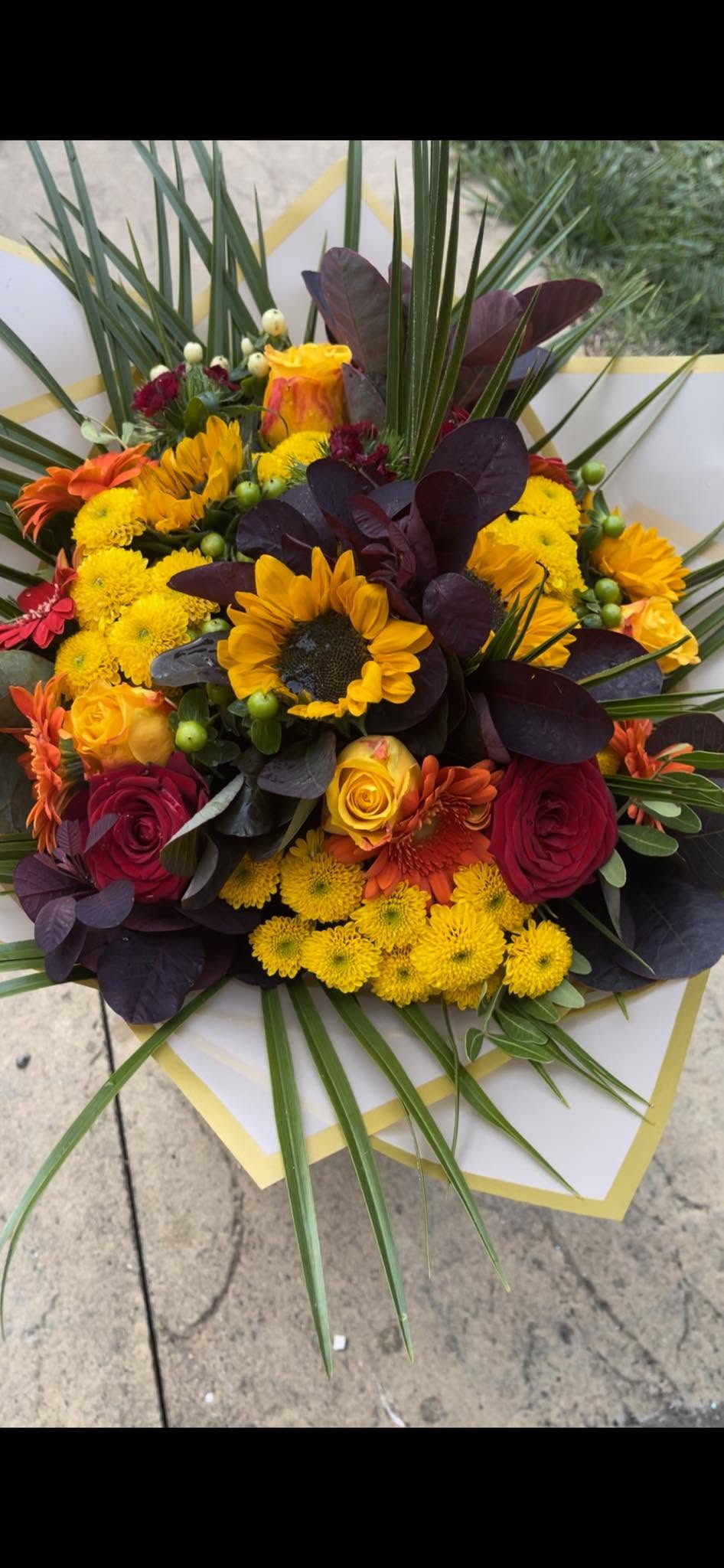 Sunflower and red rose autumn bouquet