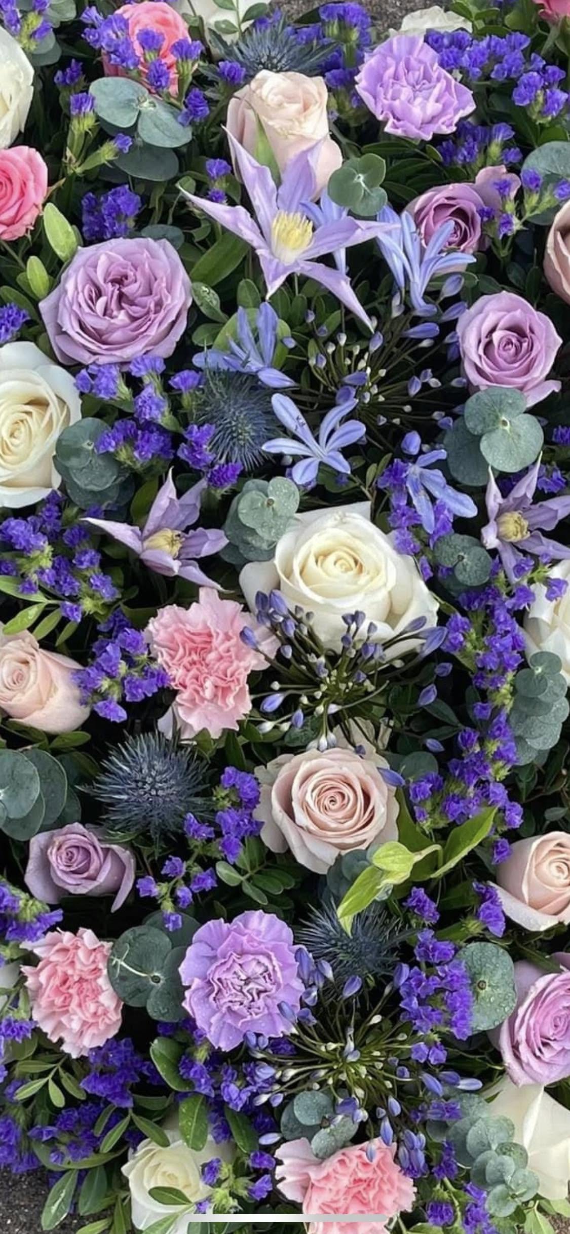 Close-up of a lilac, blue and blush floral spray
